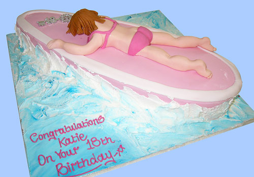 Relaxing on a surf board birthday cake